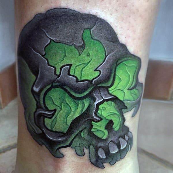 Grey skull tattoo with shamrock face