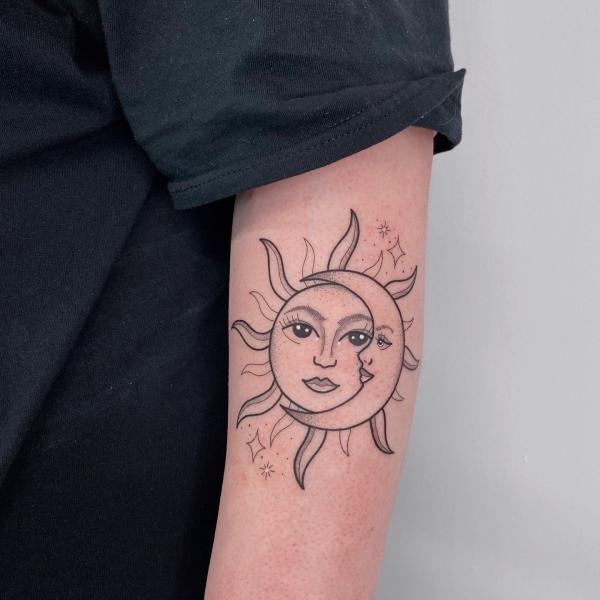Half Sun half moon face outline tattoo