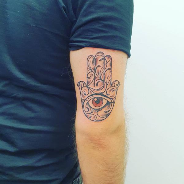 Hamsa hand with eye back of arm tattoo