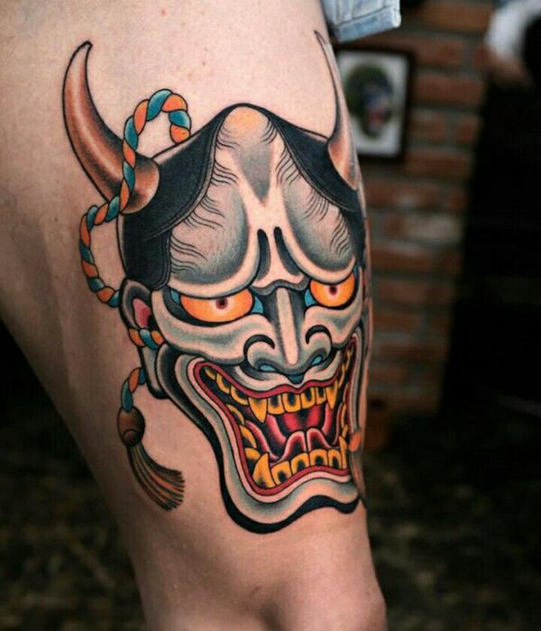 Hannya above knee tattoo