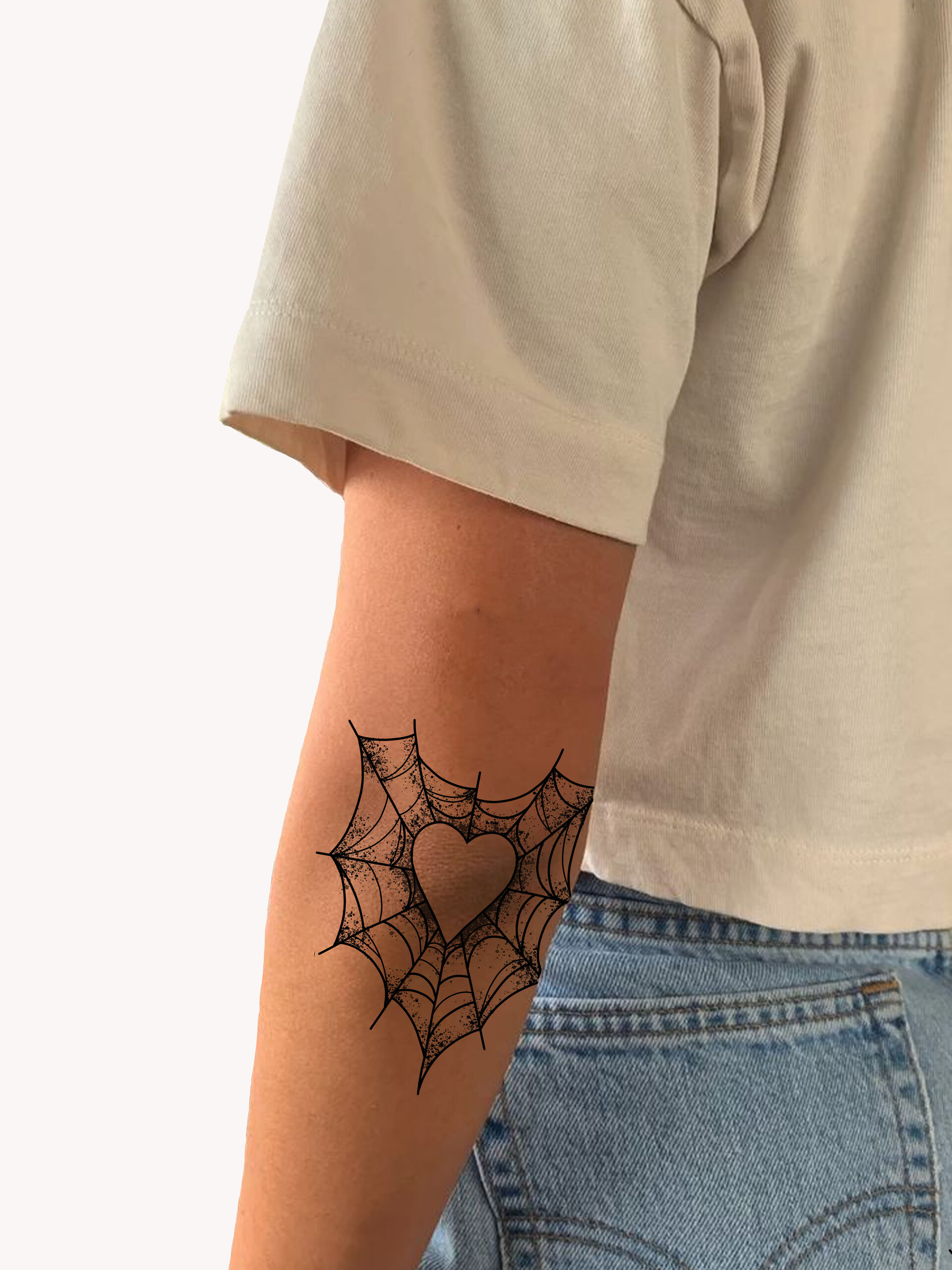Heart spiderweb elbow tattoo