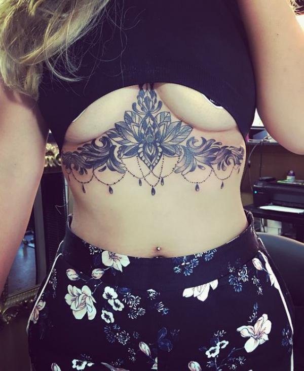 Henna lotus sternum tattoo