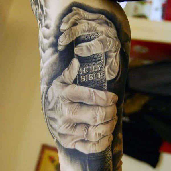 Holding the Holy Bible Christian tattoo