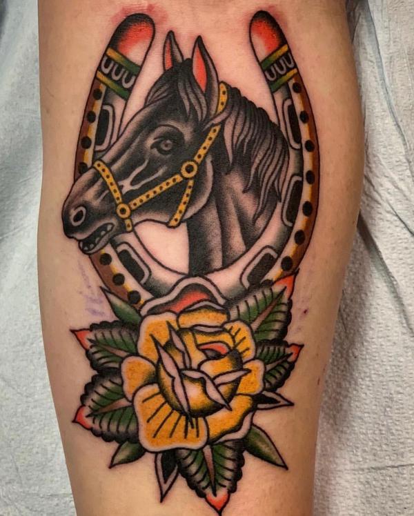 Horse and horseshoe with yellow rose tattoo traditional