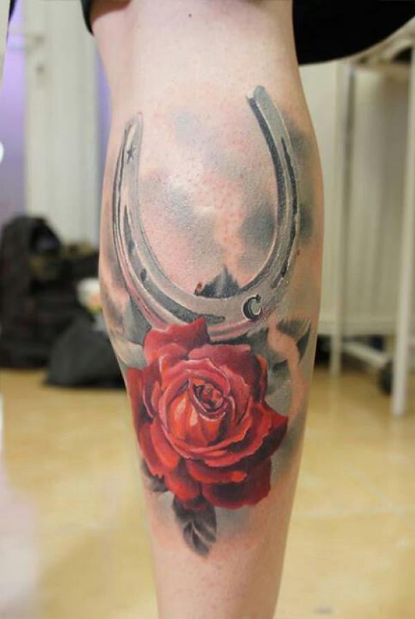 Horseshoe and rose calf tattoo