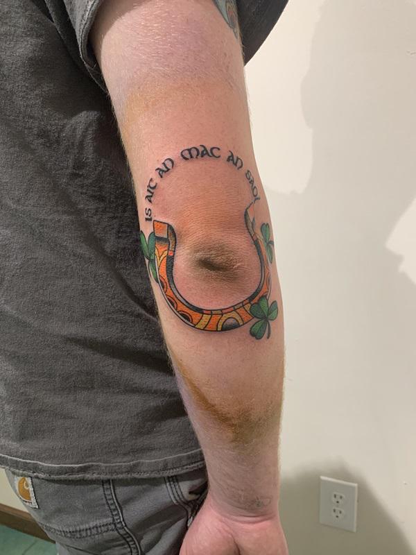Horseshoe elbow tattoo 1