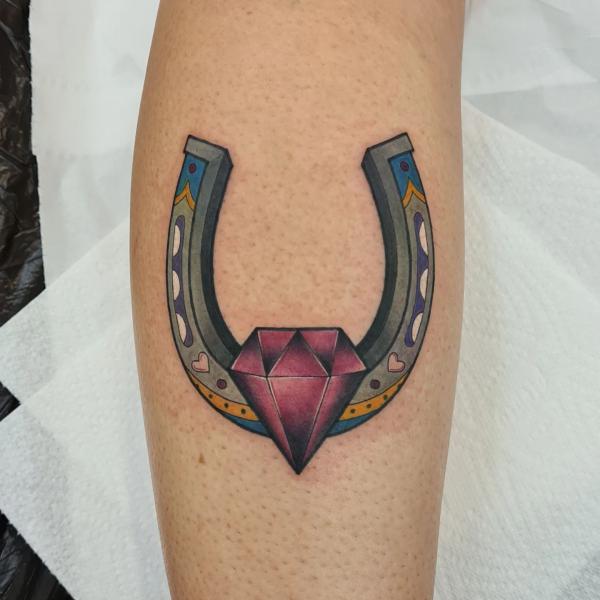 Horseshoe with diamond tattoo