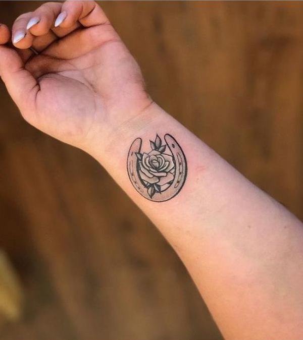 Horseshoe with rose wrist tattoo