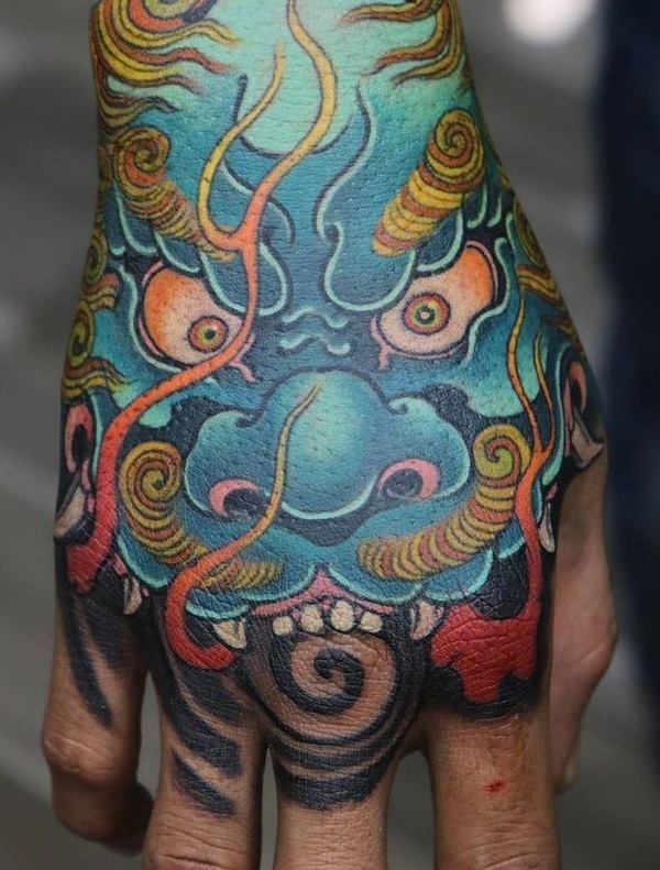 Japanese blue foo dog hand tattoo