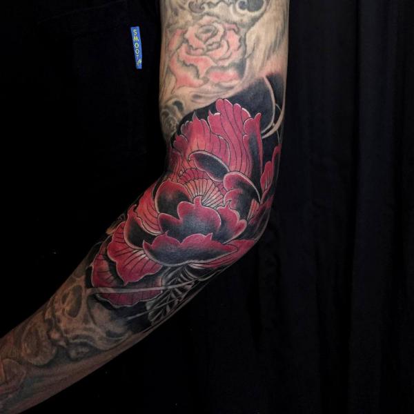 Japanese flower elbow tattoo