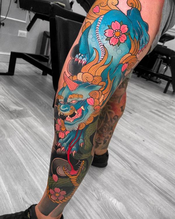 Japanese foo dog leg sleeve tattoo