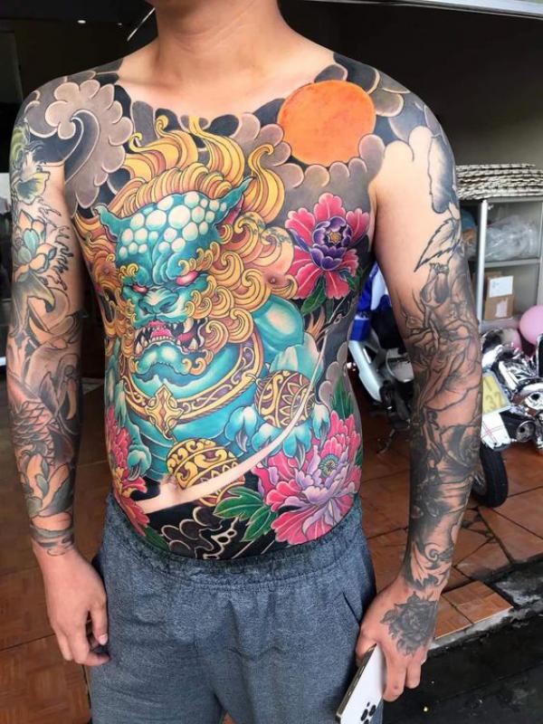 Japanese foo dog torso tattoo