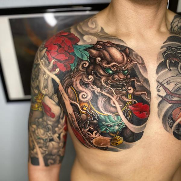 Japanese foo dog with red peony chest panel tattoo