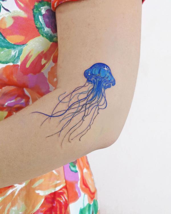Jellyfish tattoo on the side of elbow