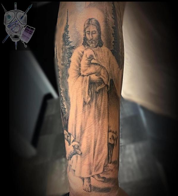 Jesus holding lamb tattoo