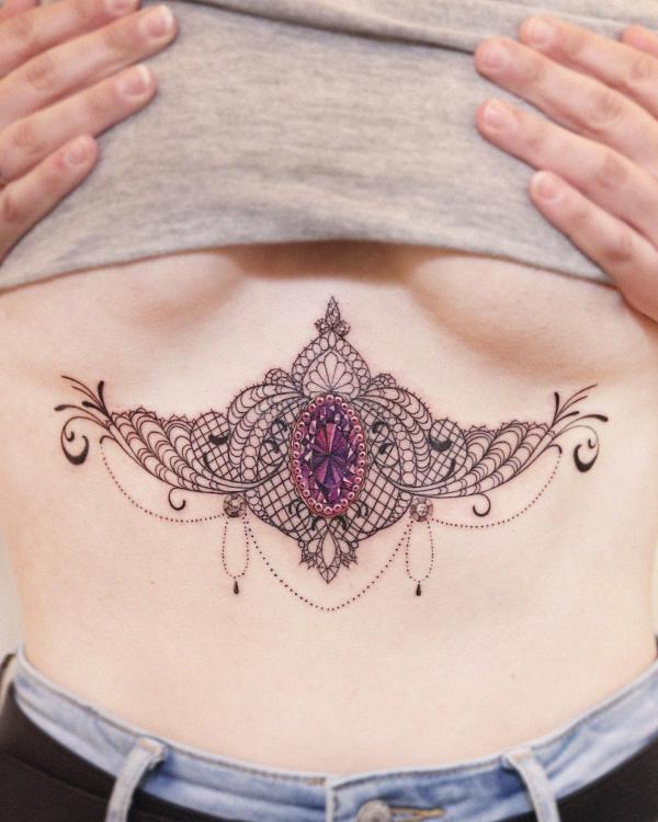 Lace with diamond sternum tattoo