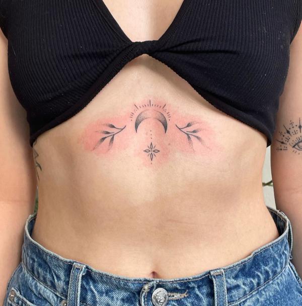 Leaves and moon sternum tattoo