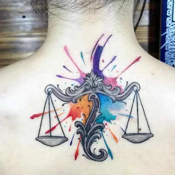 Libra scale on watercolor back tattoo