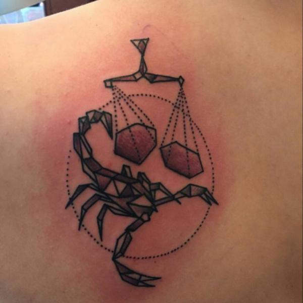 Libra scales and scorpion tattoo