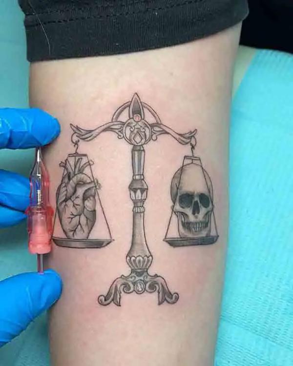 Libra scales with heart and skull tattoo