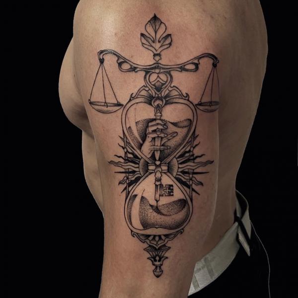 Libra with hourglass tattoo
