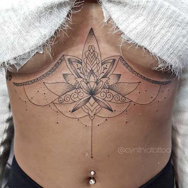 Lotus dotwork sternum tattoo