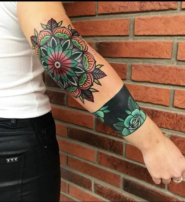 Lotus flower elbow tattoo traditional