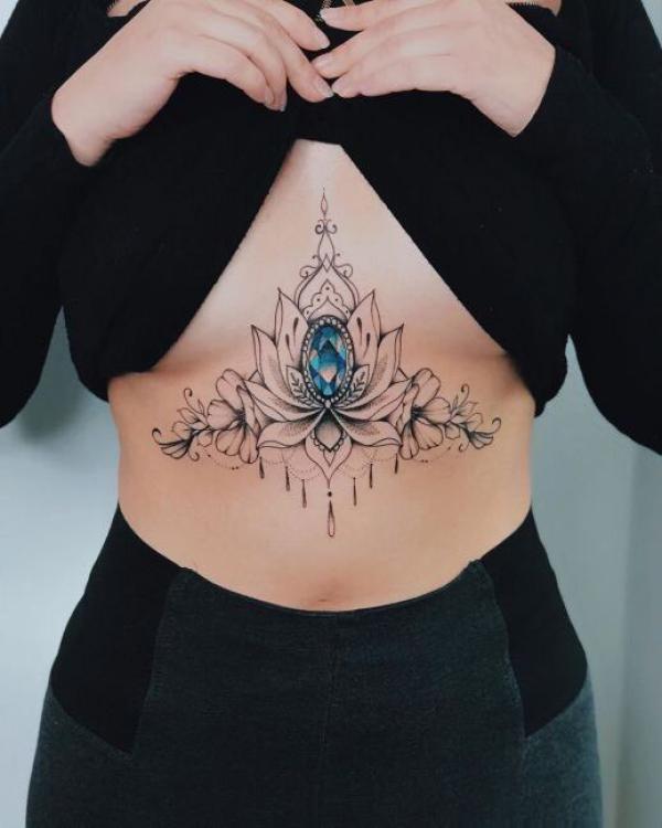 Lotus with diamond sternum tattoo