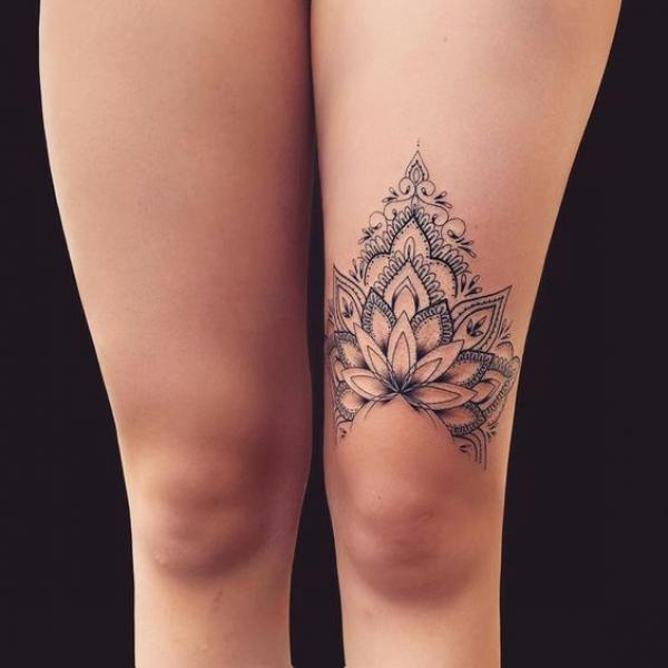 Mandala above knee tattoo