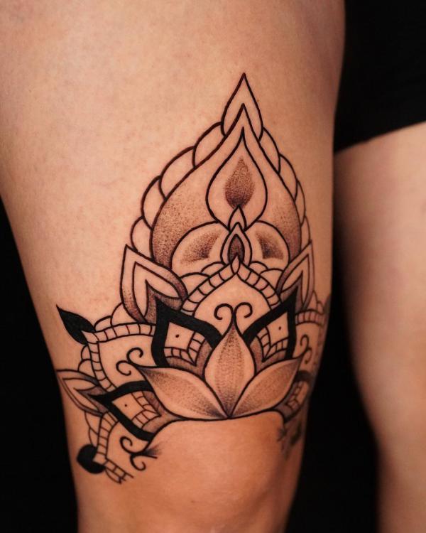 Mandala lotus above knee tattoo
