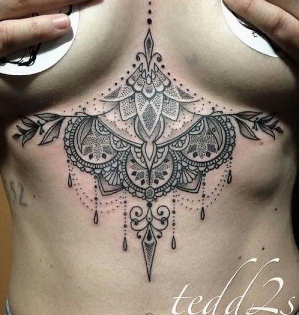 Mandala lotus with pendant and Unalome sternum tattoo