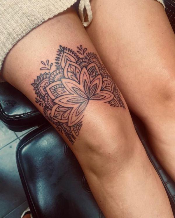 Mandala tattoo above knee