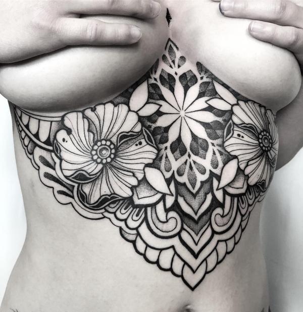 Mandala with poppy sternum tattoo