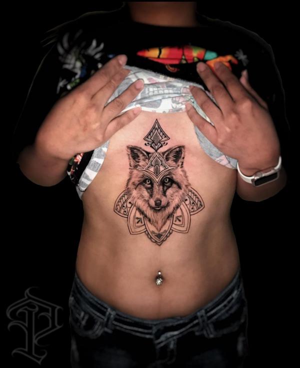 Mandala wolf sternum tattoo