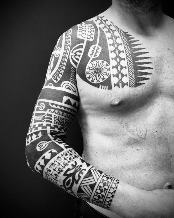 Maori tribal chest to sleeve tattoo