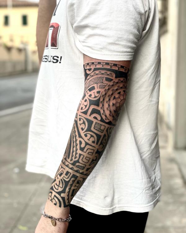 Maori tribal half sleeve tattoo