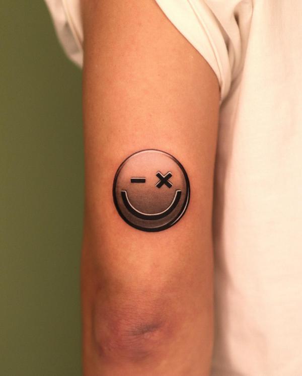 Math emojis back of arm tattoo