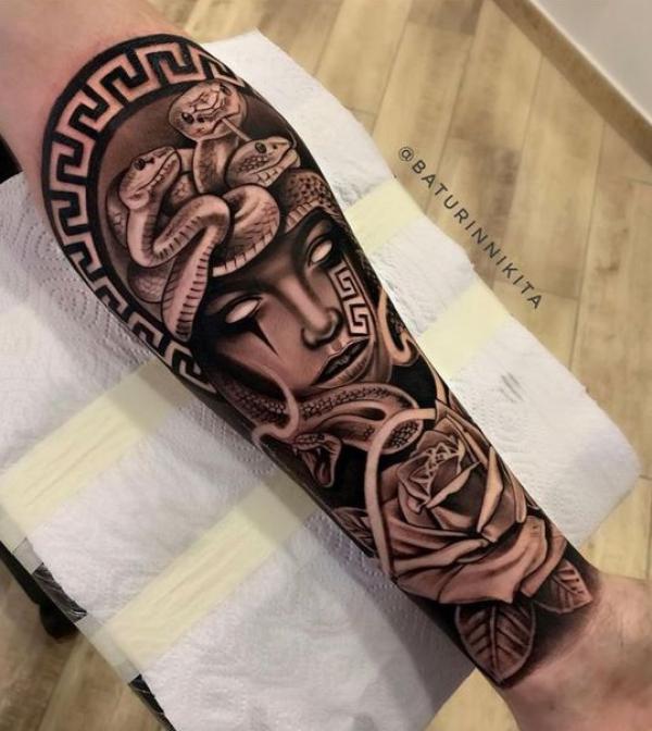 Medusa and rose forearm tattoo