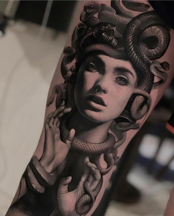Medusa and snakes arm tattoo