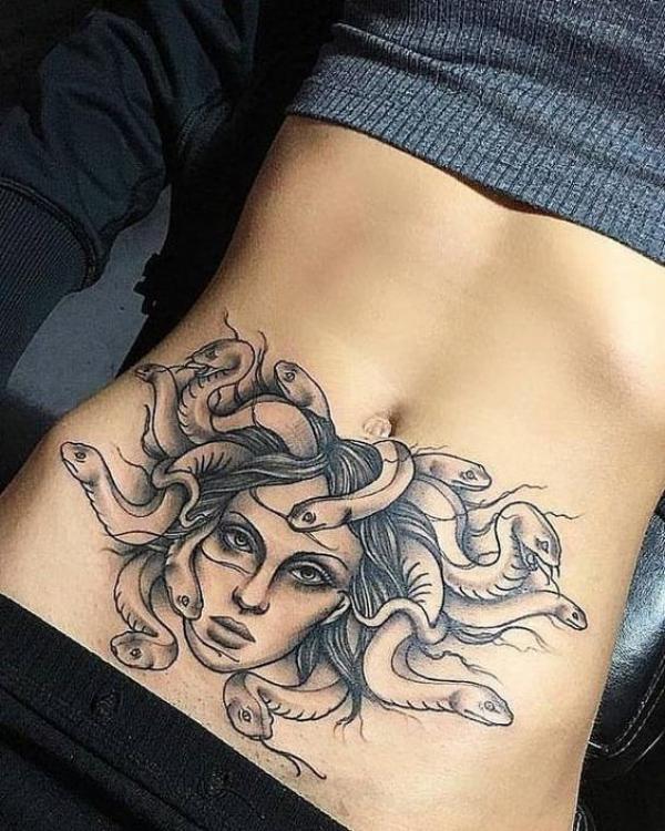 Medusa belly tattoo