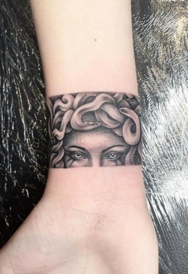 Medusa eyes wrist tattoo