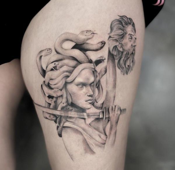 Medusa holding Perseus head tattoo