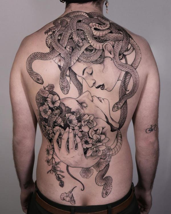 Medusa holding a head back tattoo