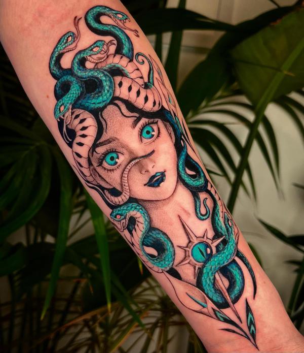 Medusa with black and green snakes tattoo
