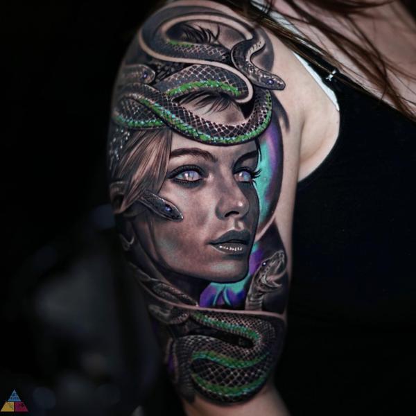 Medusa with black and green tattoo half sleeve