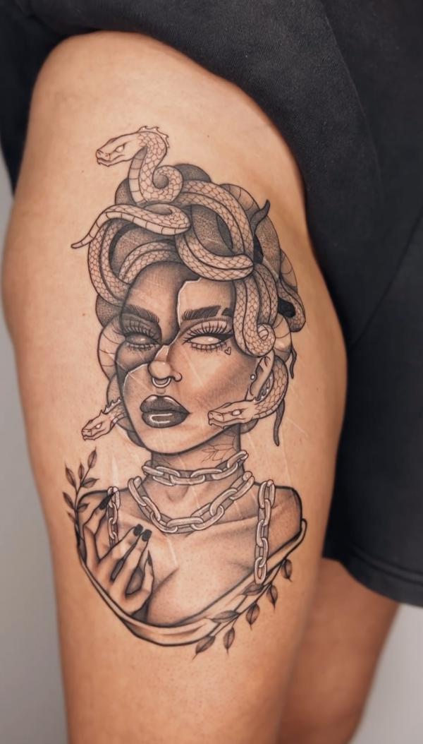 Medusa with chain necklace tattoo