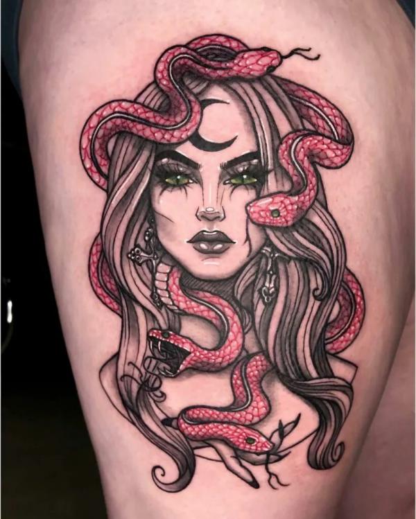 Medusa with red snake tattoo