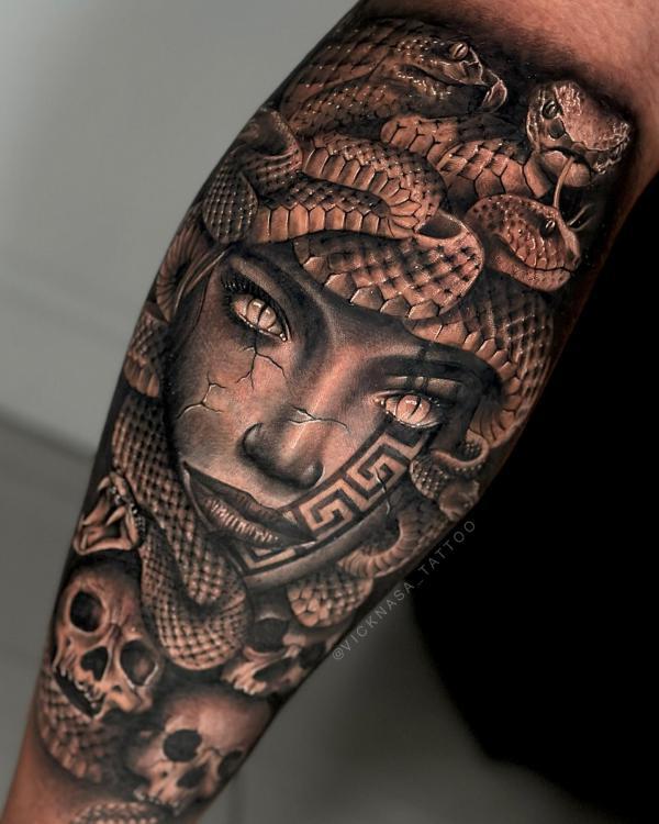 Medusa with skulls arm tattoo