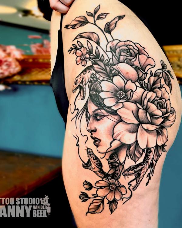 Medusa with snake and flowers tattoo