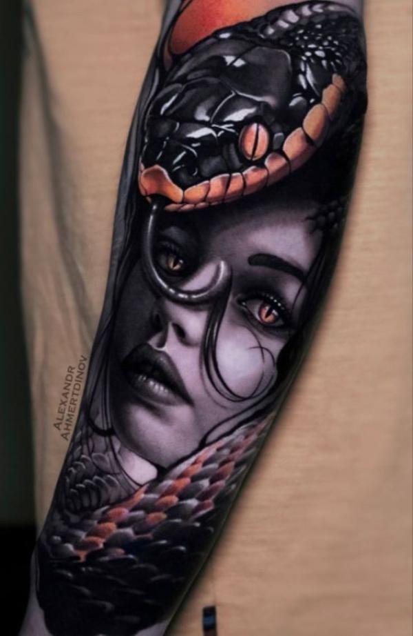 Medusa with snake forearm tattoo